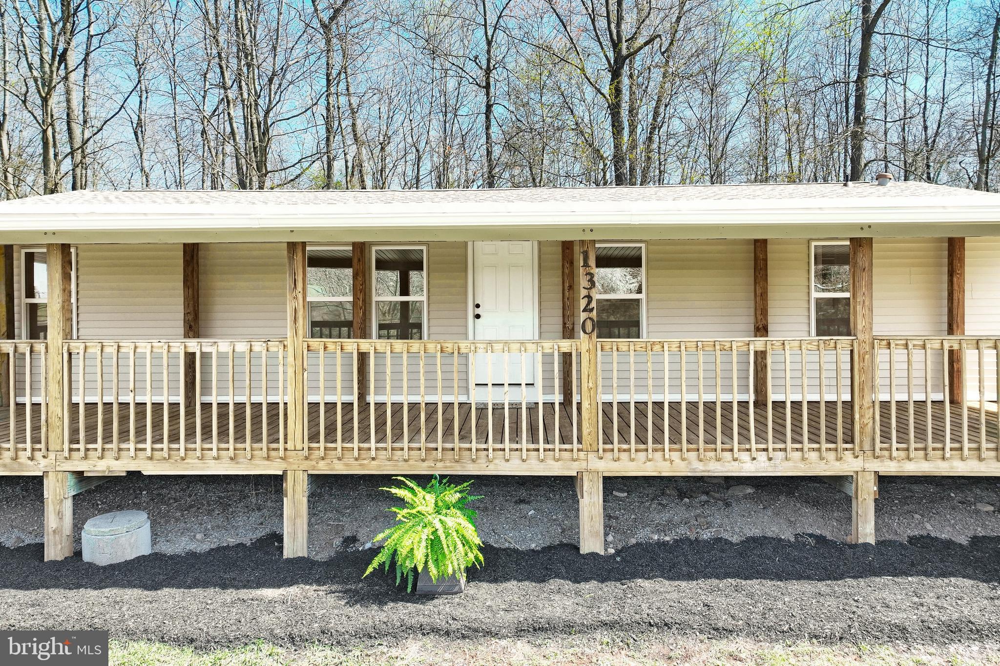 1320 Erney Road Dover, PA 17315 - Photo 5 of 35 a front view of a house with a porch