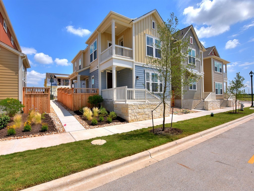a view of a house with a yard and plants