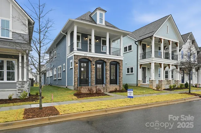a front view of a building with a yard
