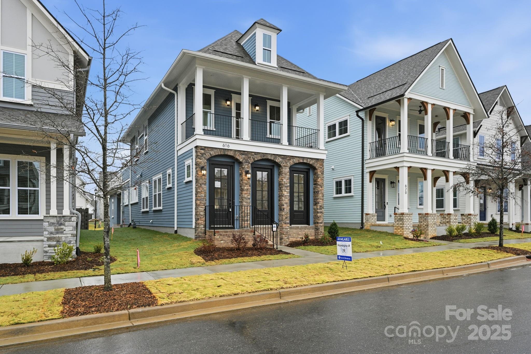 a front view of a building with a yard