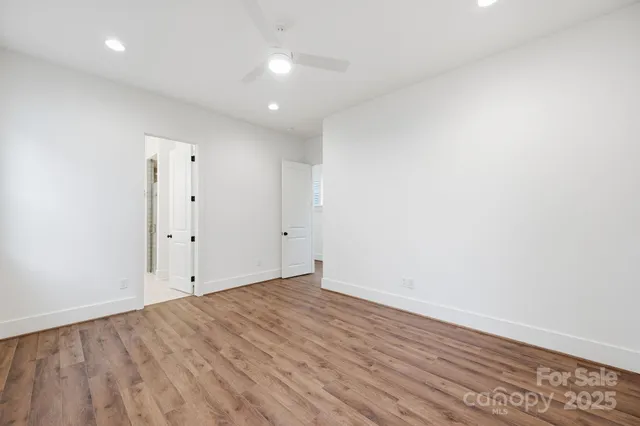 an empty room with wooden floor