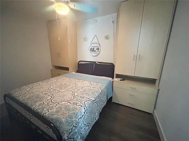 a bedroom with a bed and a closet