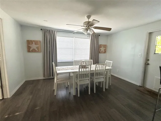 a dining room with furniture and window