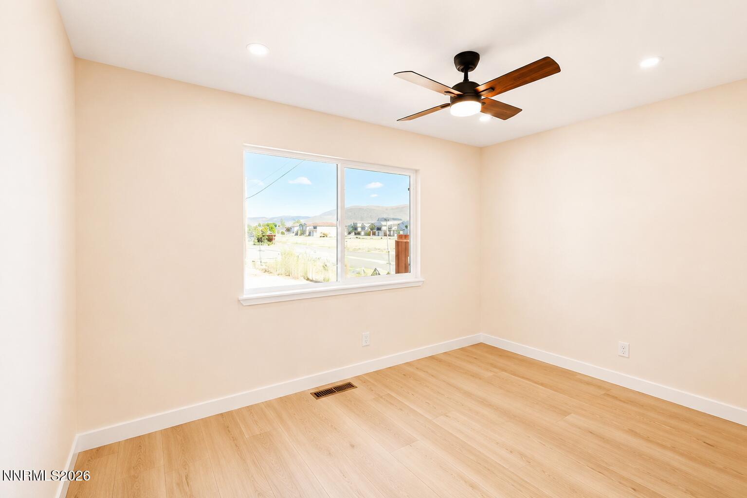 742 Ruth Street Carson City, NV 89701 - Photo 15 of 25 a view of an empty room with a window