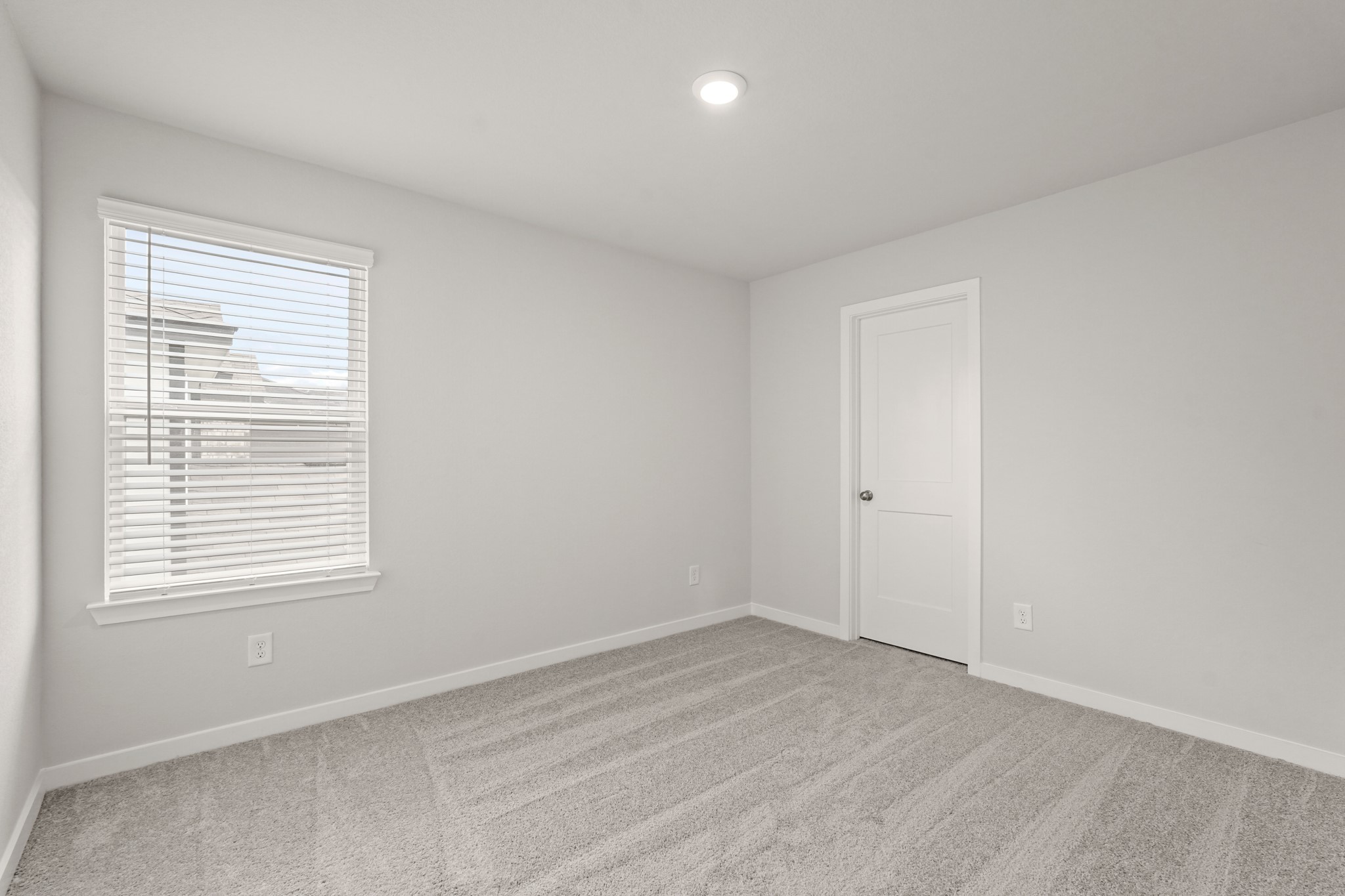 113 Rising Cedar Lane Hockley, TX 77447 - Photo 19 of 27 a view of an empty room with wooden floor and a window