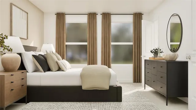 a bedroom with a bed and a dresser