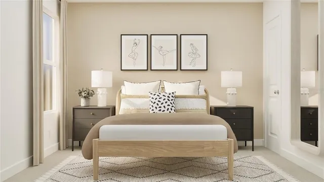 a bedroom with a bed and a painting on the wall