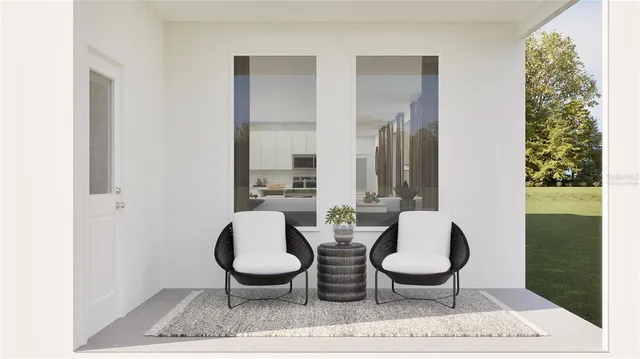 a living room with furniture rug and outdoor view