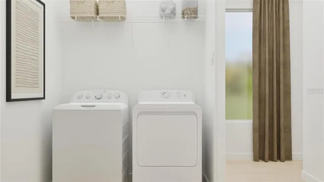 a utility room with dryer and washer