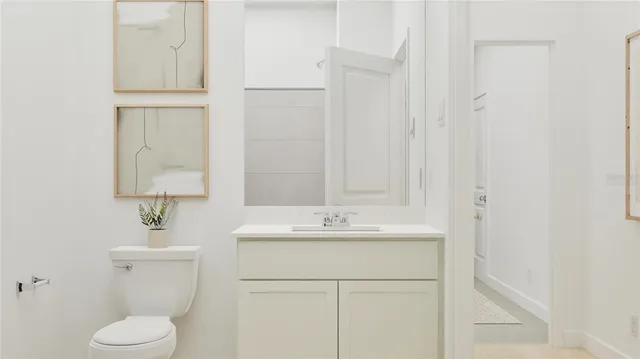 a bathroom with a sink toilet and vanity