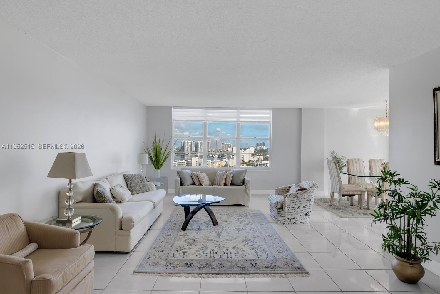 231 174th Street, Unit 2018 Sunny Isles Beach, FL 33160 - Photo 7 of 25 a living room with furniture and a rug