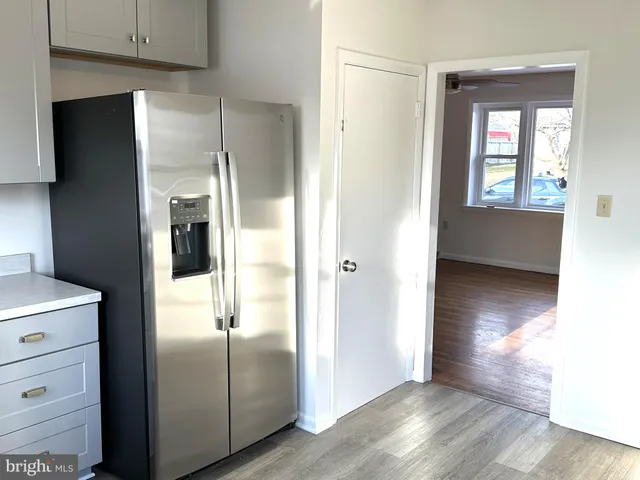 a view of livingroom with hardwood floor and hallway