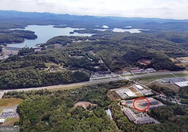 a kitchen with a sink a counter top space and stainless steel appliances