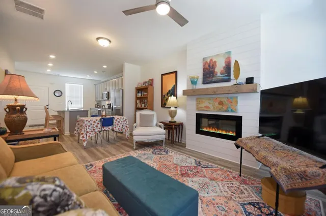 a view of a house with a swimming pool and a yard