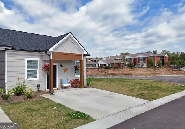 a front view of a house with a yard