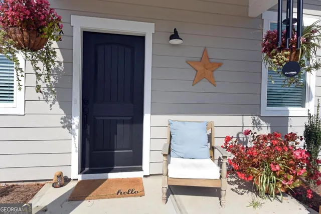 a front view of a house with garden