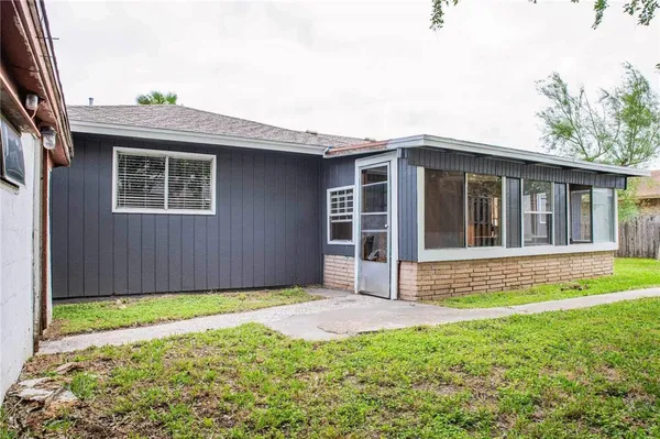 a view of a livingroom with furniture and a window
