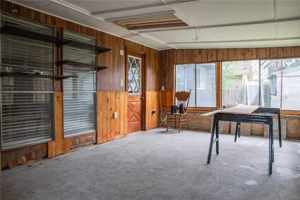 a view of a backyard with wooden fence