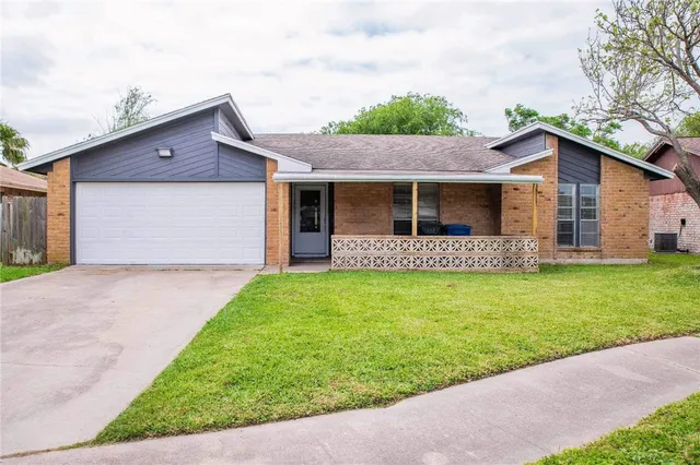 a front view of house with yard and porch