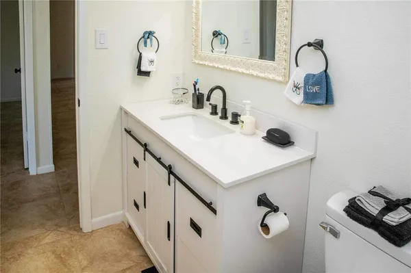 a bathroom with a sink and mirror