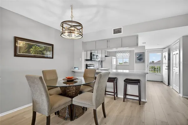 a dining room with furniture and window