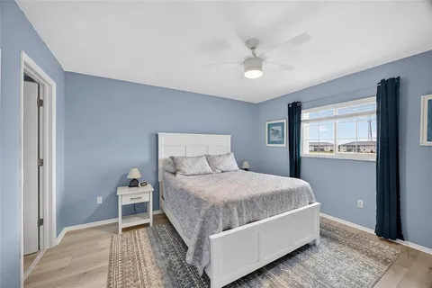a bedroom with a bed and a cabinets
