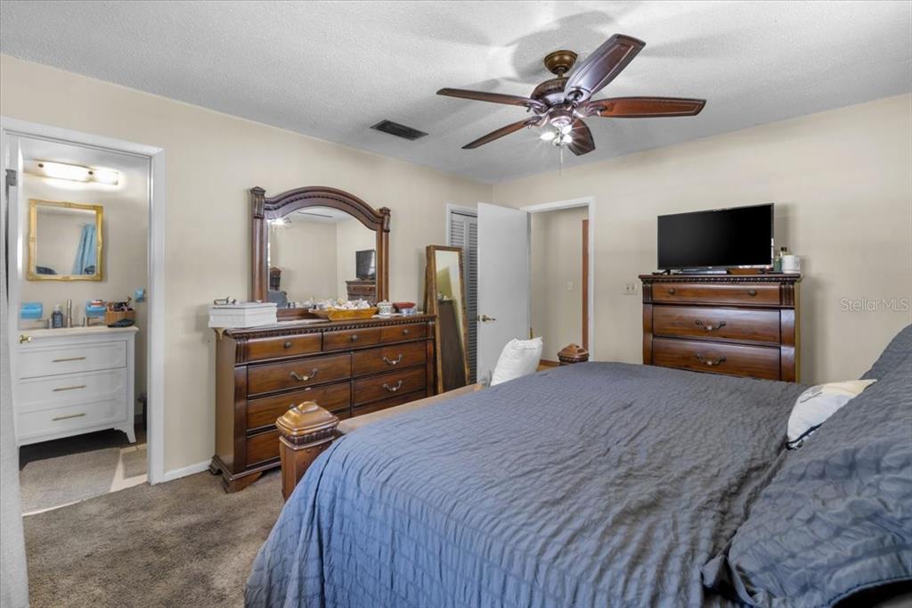 7422 County Road 231 Lake Butler, FL 32054 - Photo 28 of 57 a bedroom with a bed and a flat screen tv