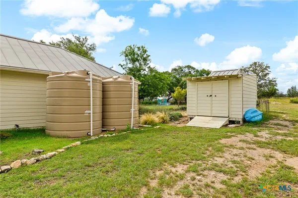 a view of a backyard with a garden