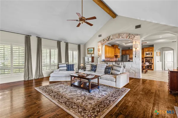 a living room with furniture and a large window