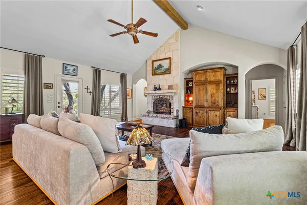 a view of a living room and entryway