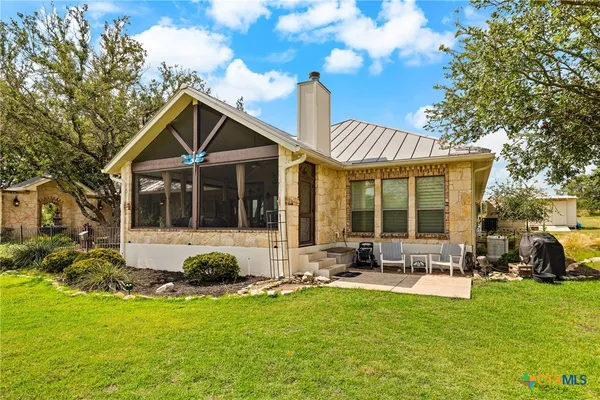 a front view of house with yard outdoor seating and green space