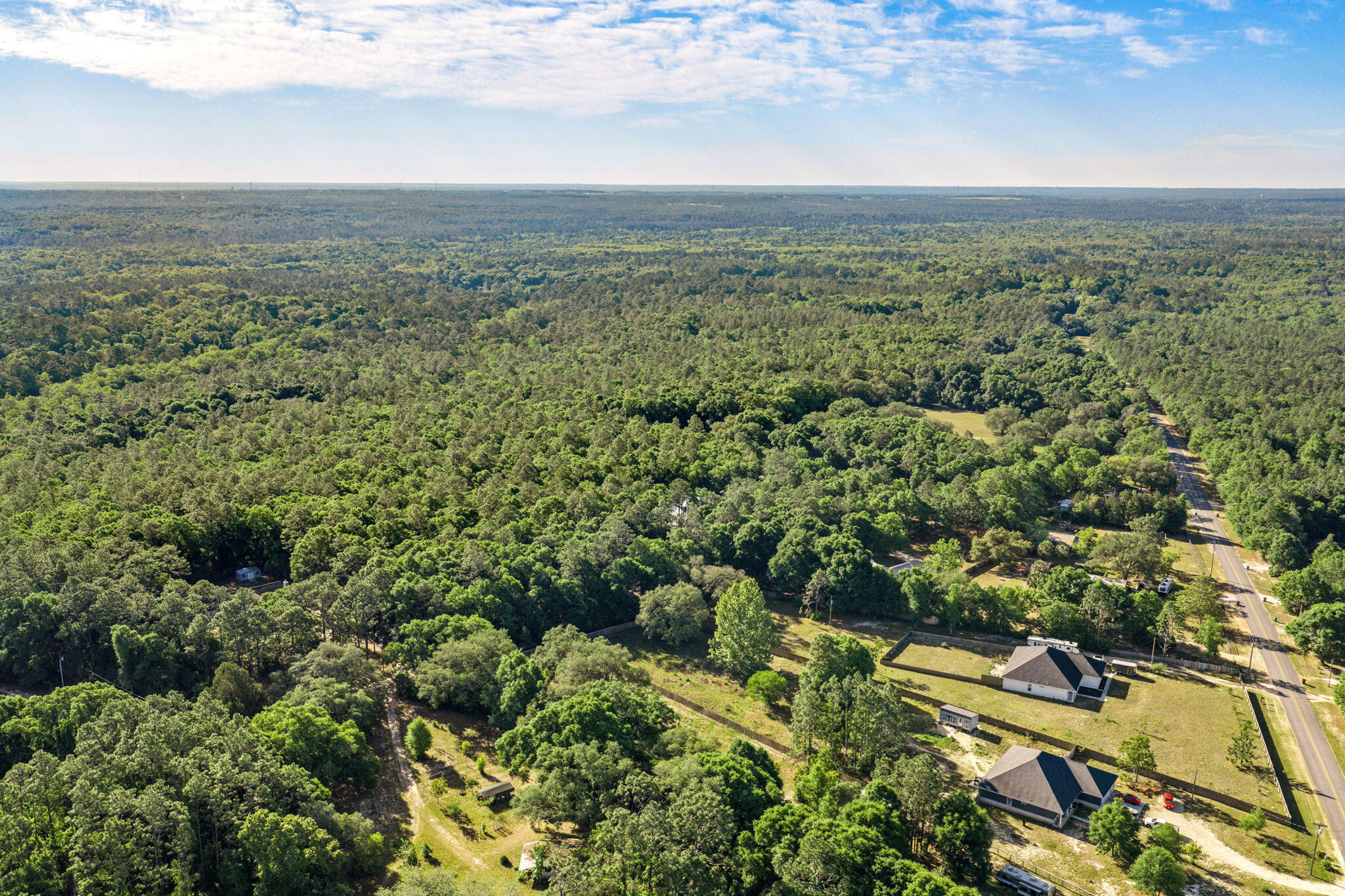 5595 Sam O'Neal Road Baker, FL 32531 - Photo 2 of 15 a view of a city with green space