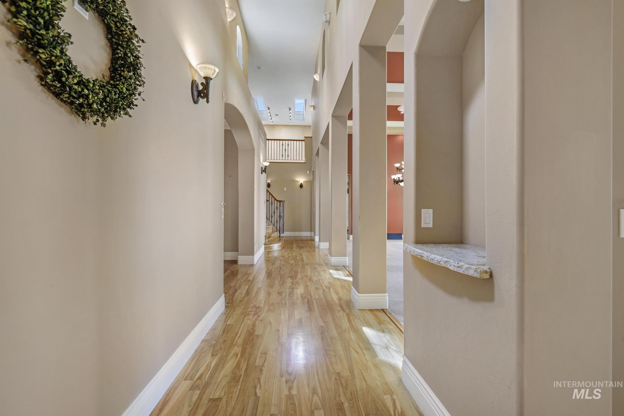 1526 Highway 26 Gooding, ID 83330 - Photo 12 of 48 Corridor with arched walkways and light wood-type flooring