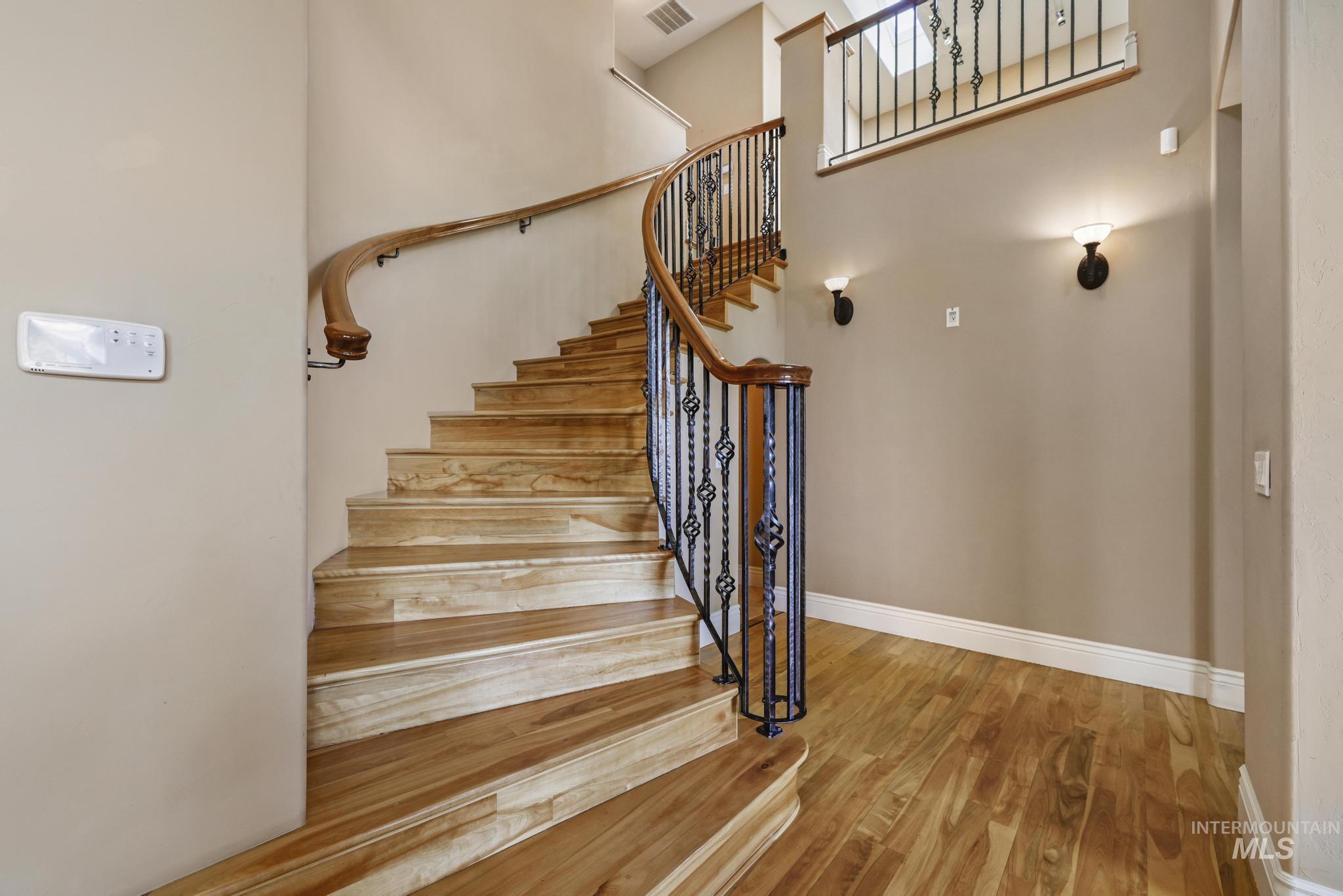 1526 Highway 26 Gooding, ID 83330 - Photo 20 of 48 Staircase featuring wood finished floors and baseboards