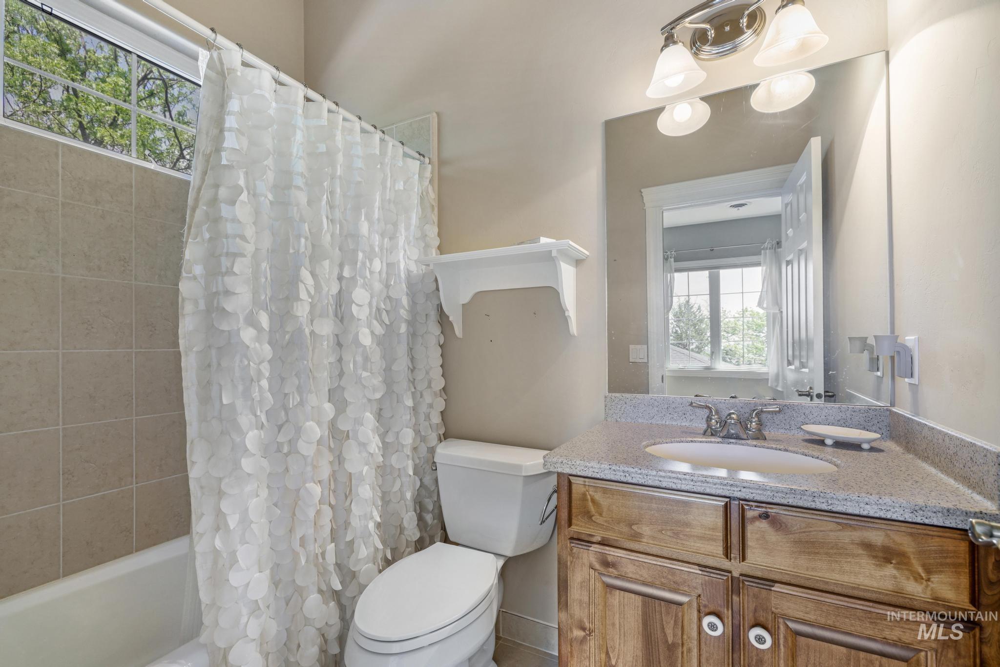 1526 Highway 26 Gooding, ID 83330 - Photo 28 of 48 Bathroom featuring shower / bath combination with curtain and vanity