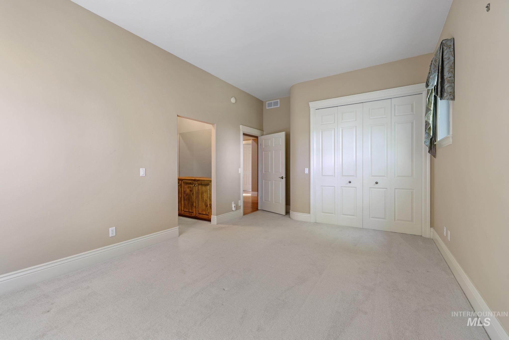 1526 Highway 26 Gooding, ID 83330 - Photo 10 of 48 Unfurnished bedroom featuring light colored carpet and a closet