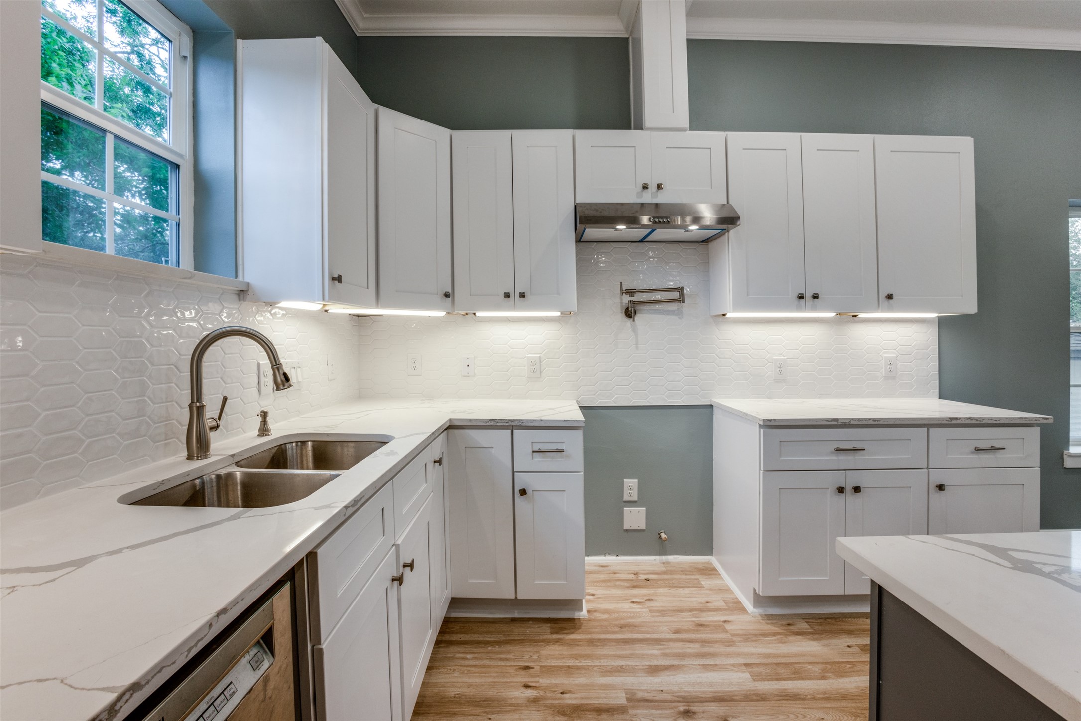 4927 East Ridge Creek Drive Houston, TX 77053 - Photo 8 of 25 a kitchen with cabinets appliances a sink and a window