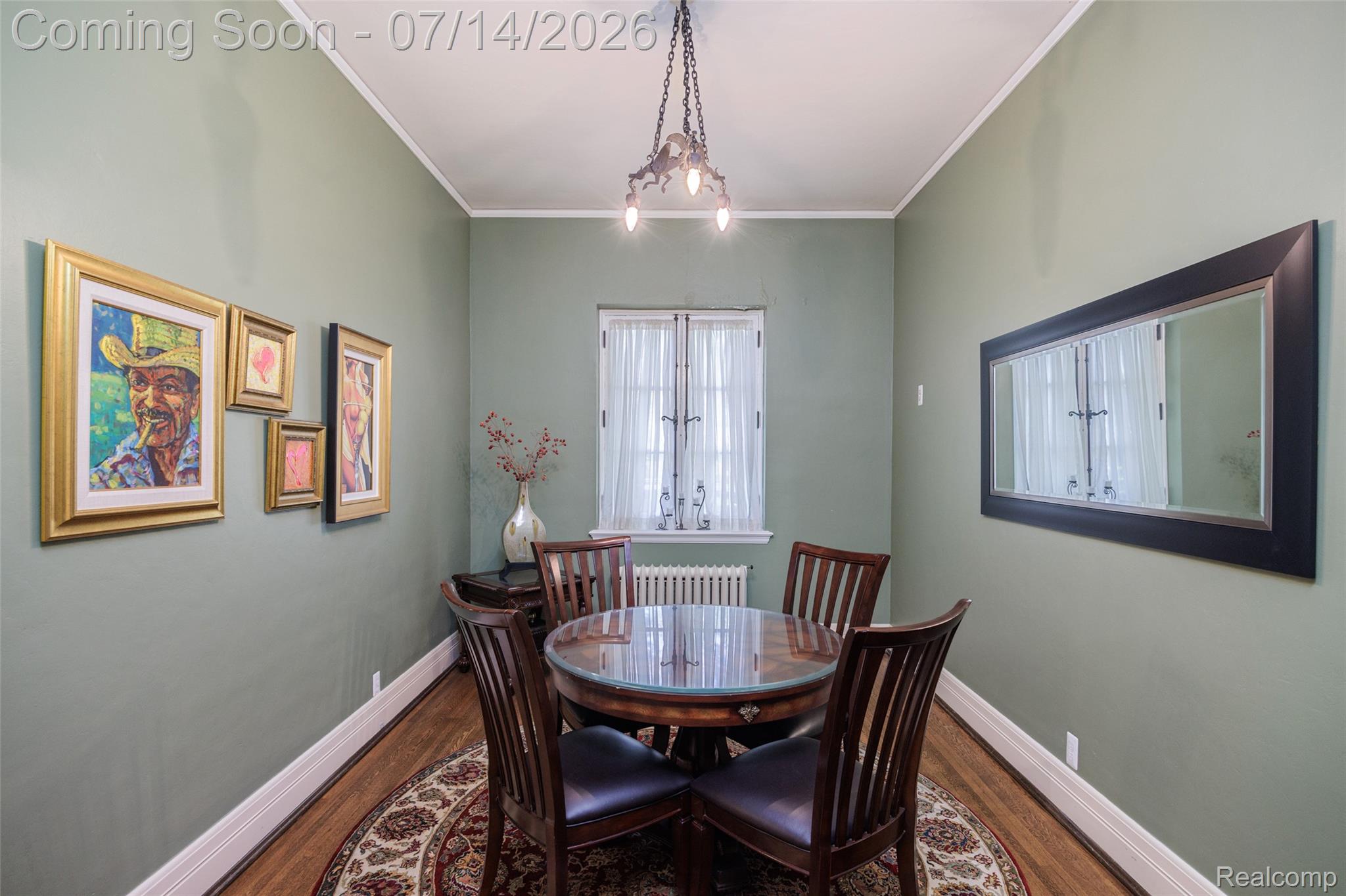 189 Cloverly Road Grosse Pointe, MI 48236 - Photo 32 of 96 Dining area featuring wood-finish flooring, light green walls, and white baseboards