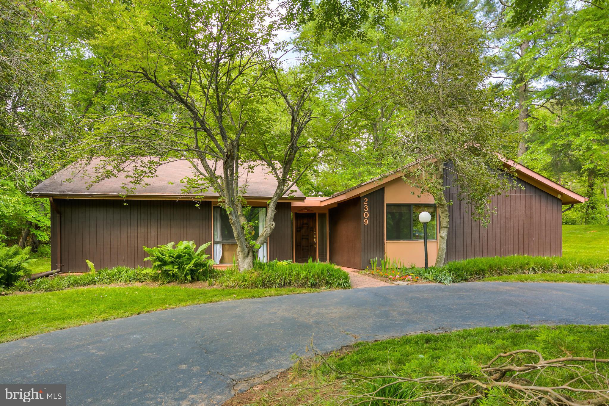 2309 November Lane Reston, VA 20191 - Photo 2 of 29 a front view of a house with garden