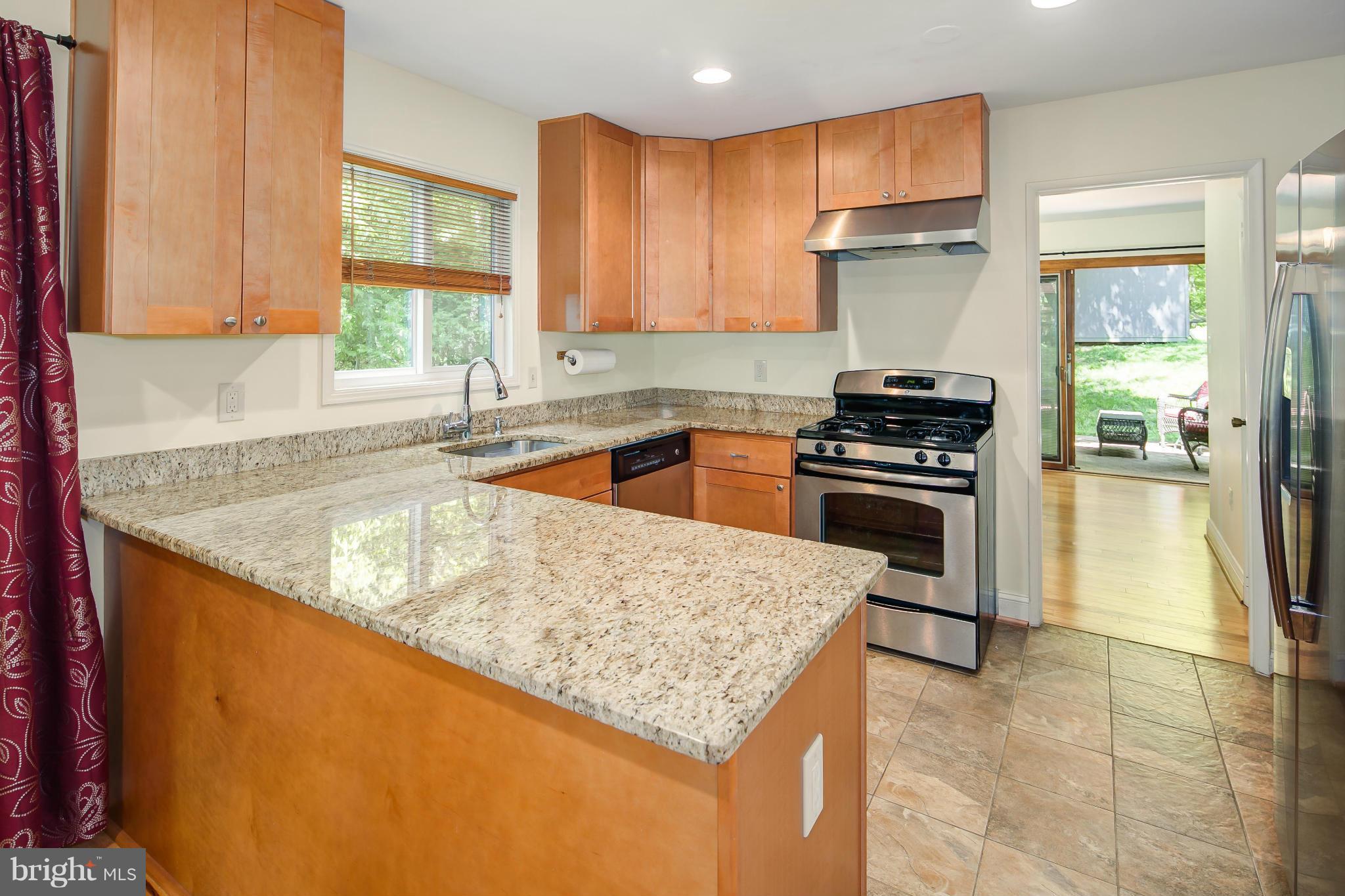 2309 November Lane Reston, VA 20191 - Photo 10 of 29 a kitchen with a stove a sink and a refrigerator