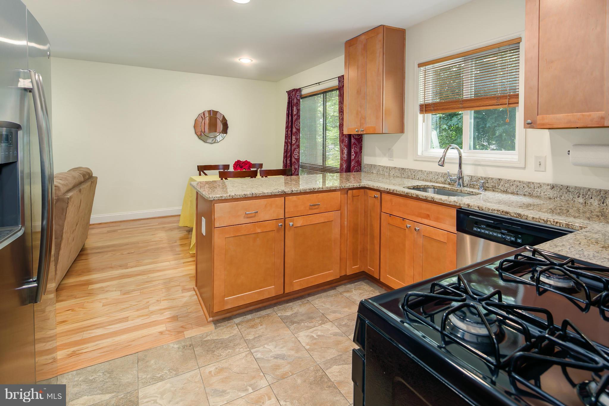 2309 November Lane Reston, VA 20191 - Photo 12 of 29 a kitchen that has a sink and a stove in it