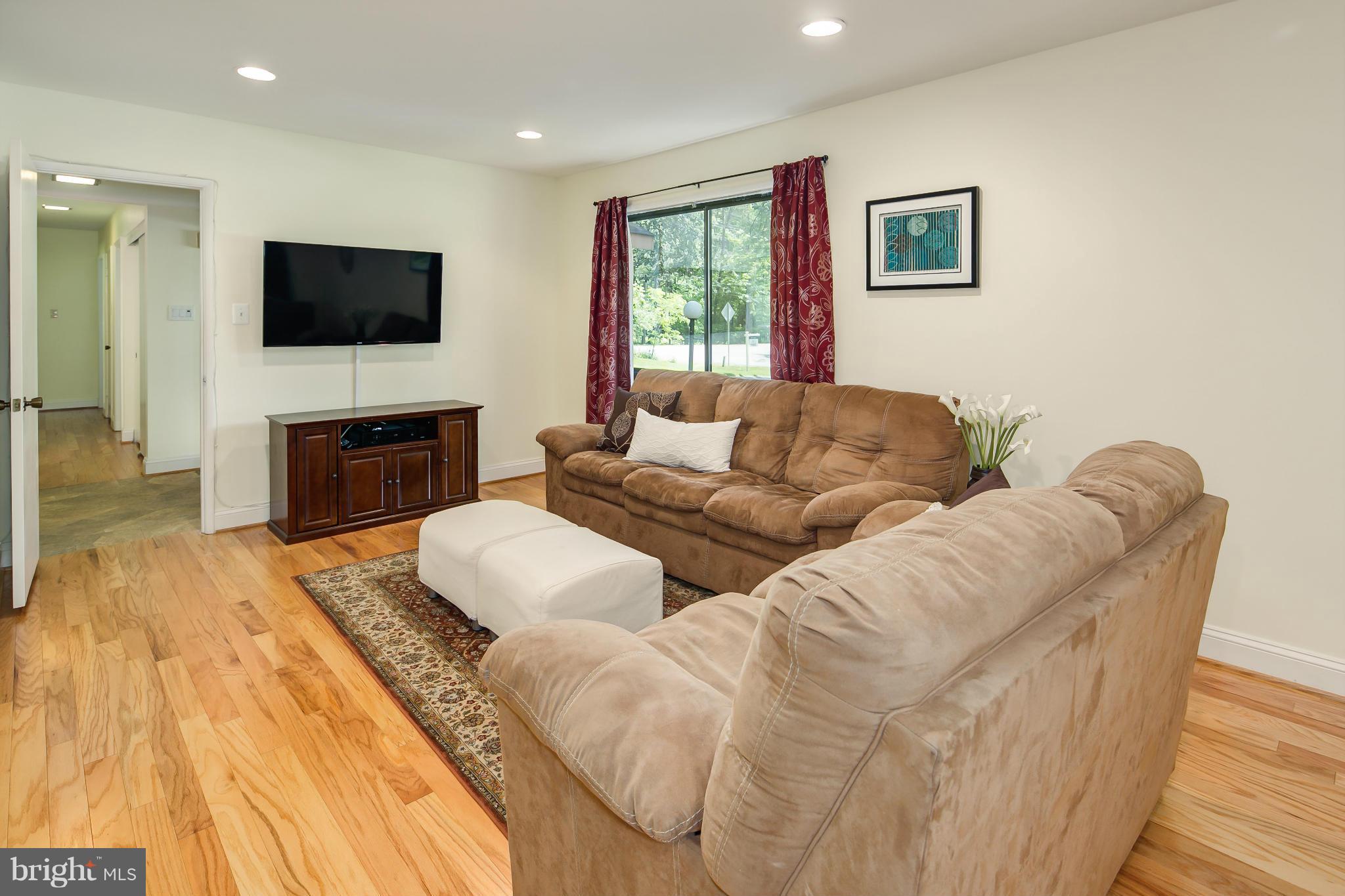 2309 November Lane Reston, VA 20191 - Photo 14 of 29 a living room with furniture and a flat screen tv