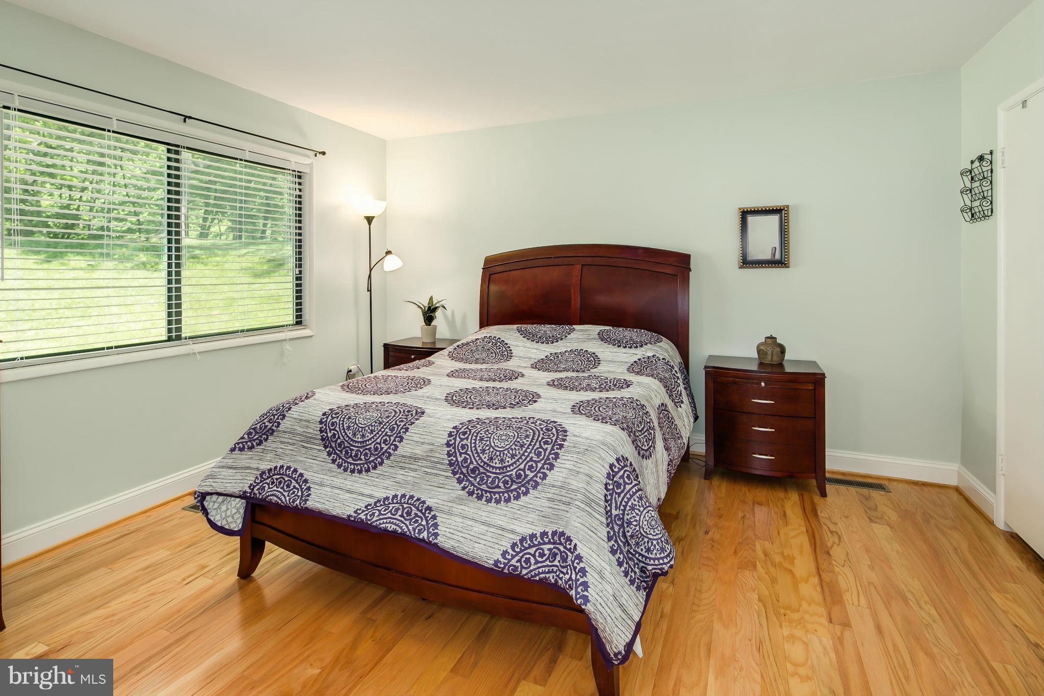 2309 November Lane Reston, VA 20191 - Photo 15 of 29 a bedroom with a bed and wooden floor