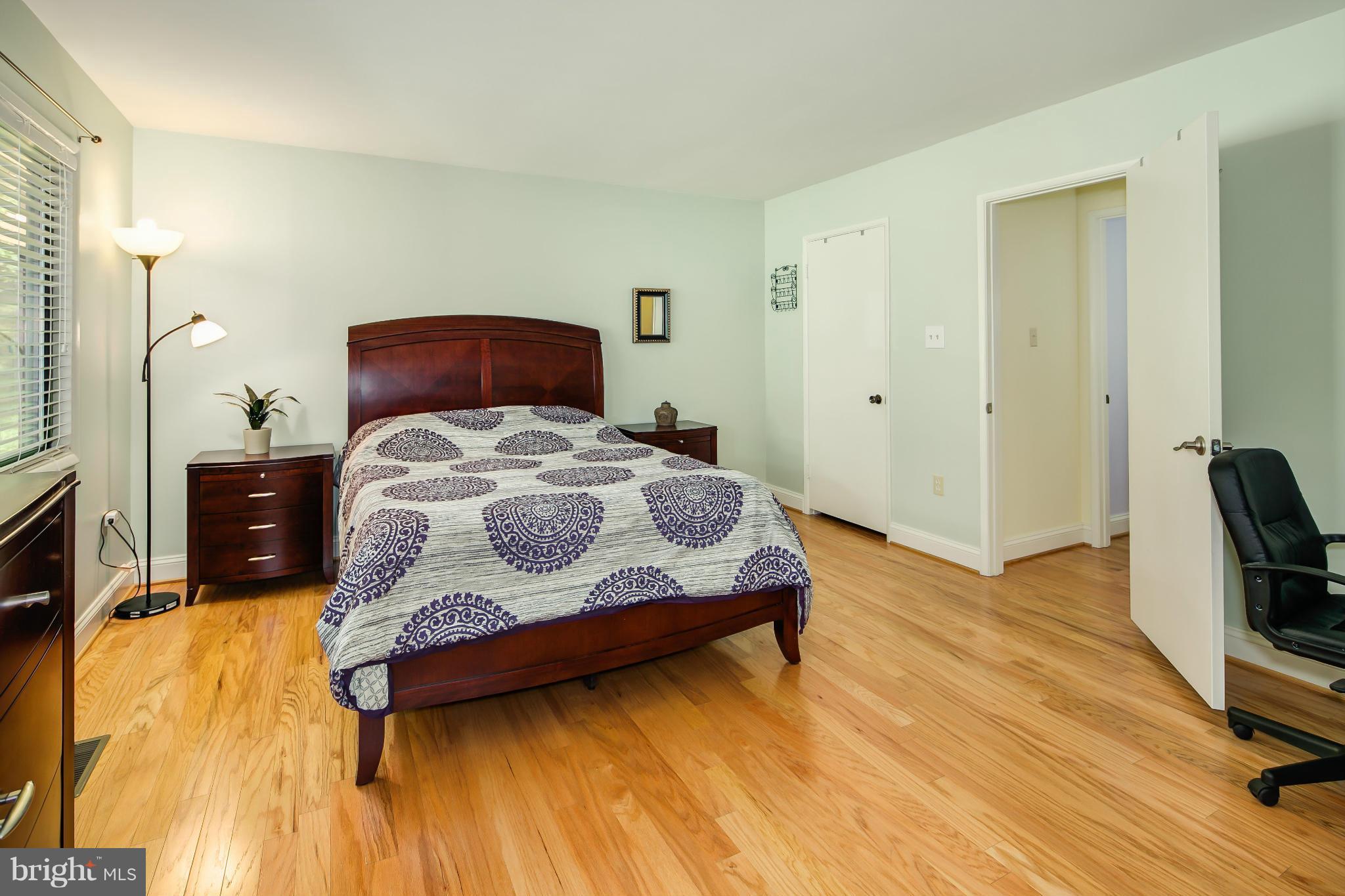 2309 November Lane Reston, VA 20191 - Photo 16 of 29 a bedroom with a bed and wooden floor