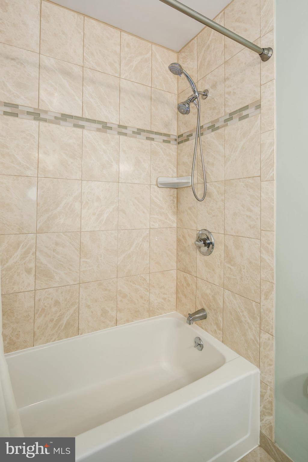 2309 November Lane Reston, VA 20191 - Photo 20 of 29 a bathroom with a bathtub and shower