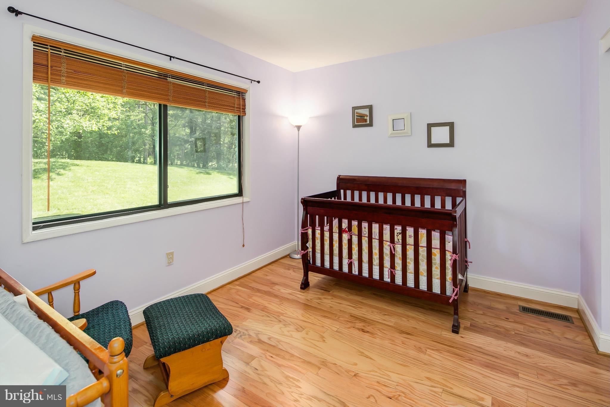 2309 November Lane Reston, VA 20191 - Photo 21 of 29 a view of a room with furniture wooden floor and windows