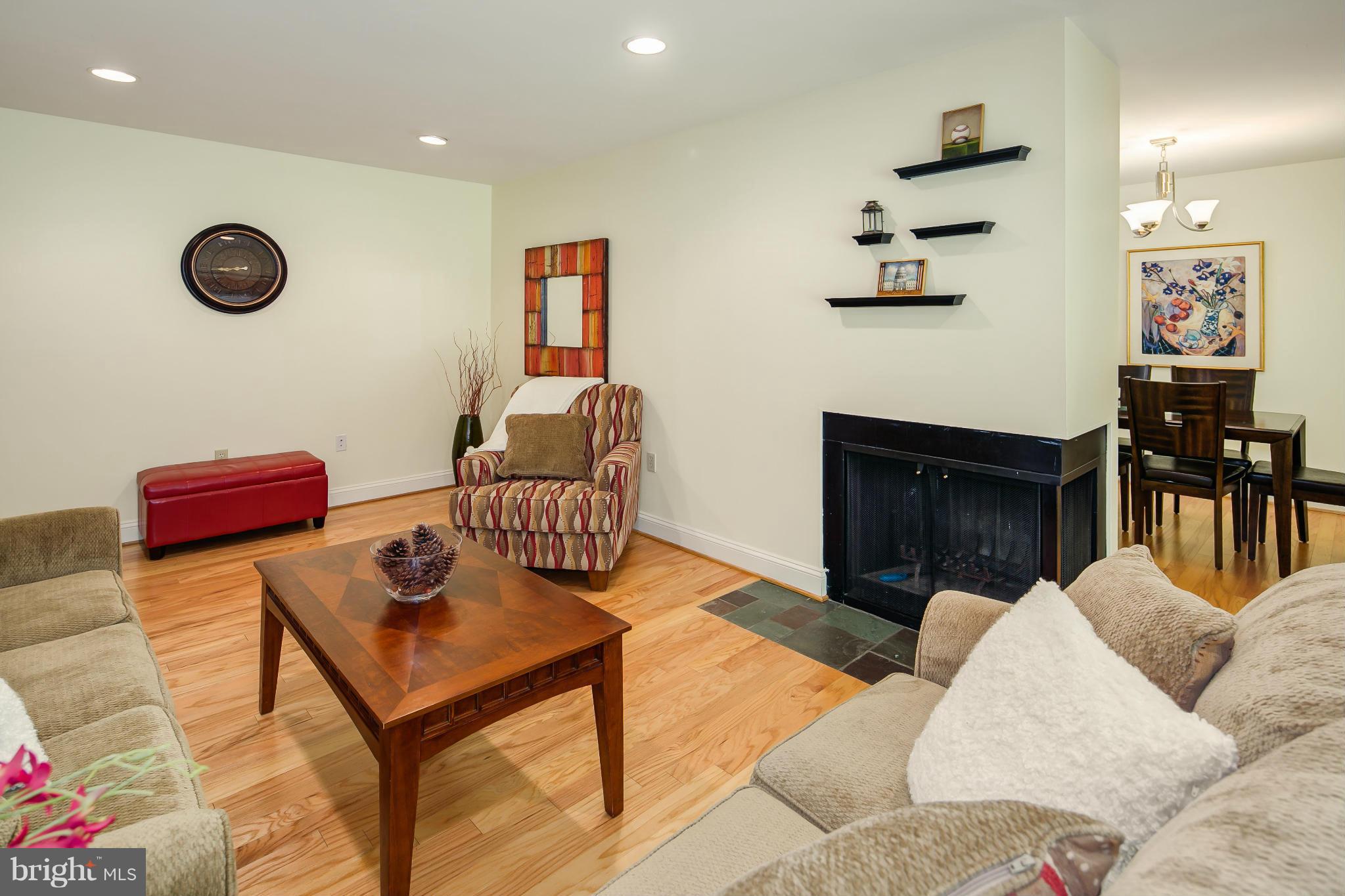 2309 November Lane Reston, VA 20191 - Photo 29 of 29 a living room with furniture and a fireplace