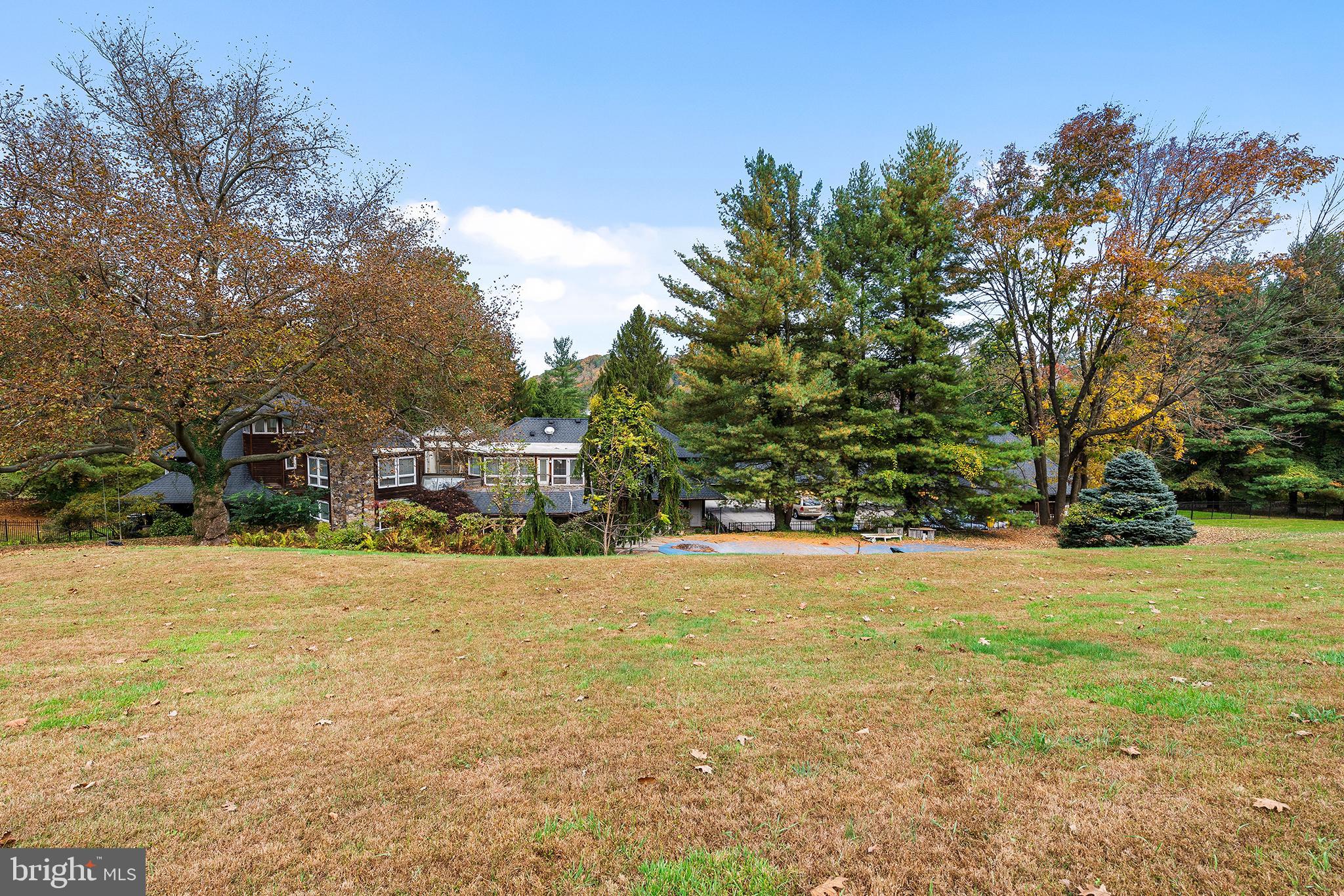 655 Matsonford Road Villanova, PA 19085 - Photo 19 of 63 a tall yellow house with trees in the background