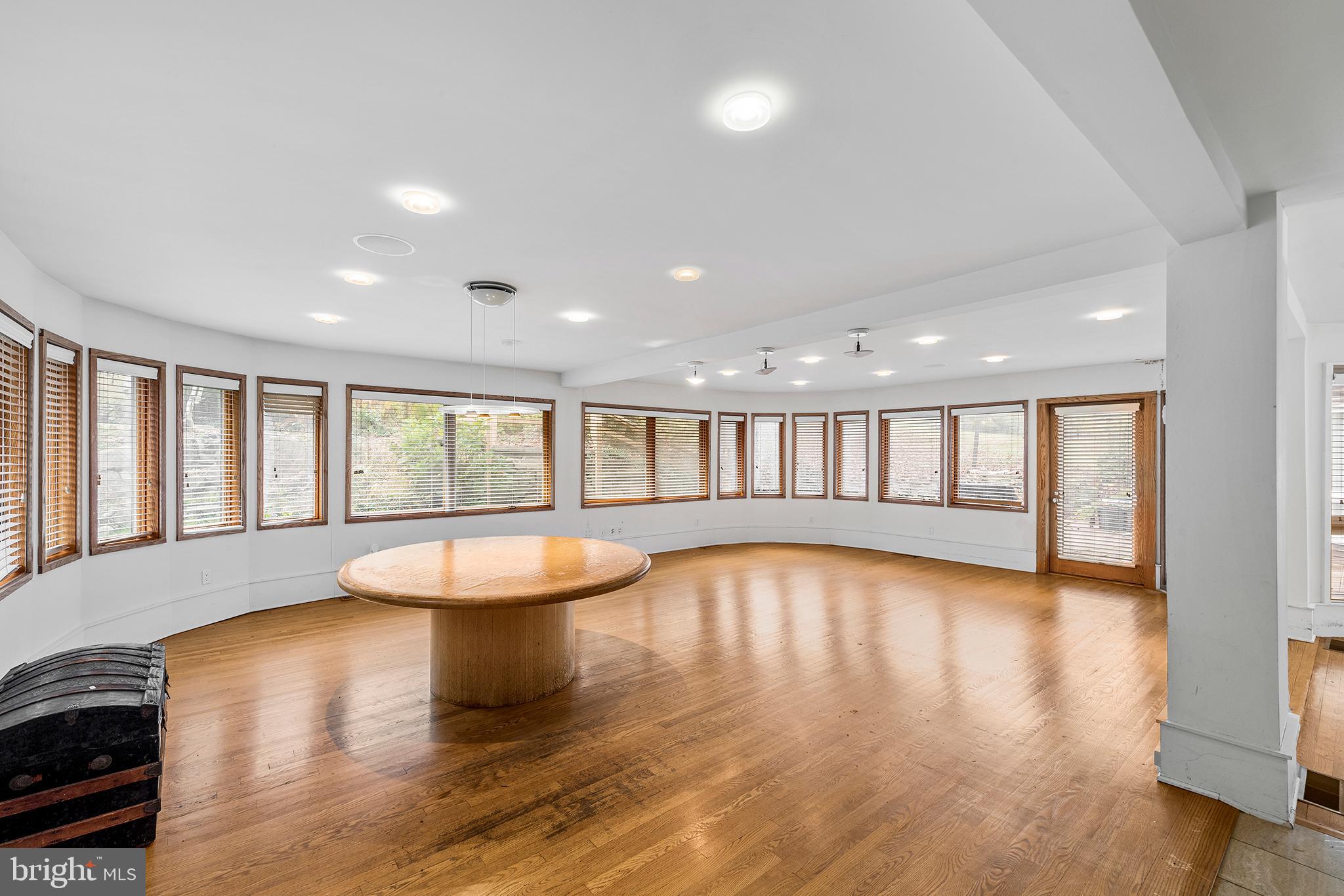 655 Matsonford Road Villanova, PA 19085 - Photo 20 of 63 a view of an empty room with wooden floor and a window