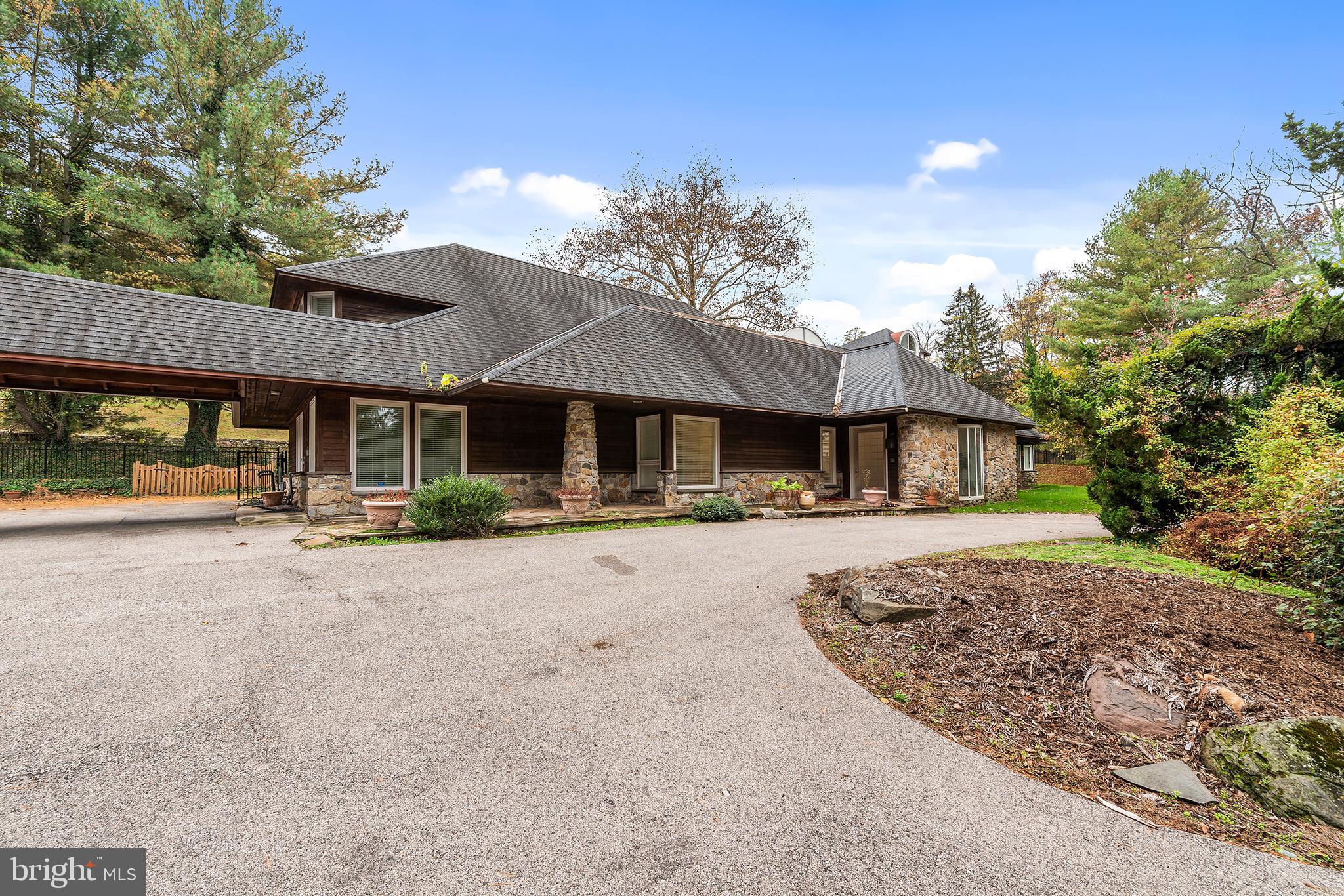 655 Matsonford Road Villanova, PA 19085 - Photo 2 of 63 a front view of a house with yard and parking